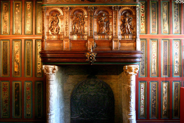 Carved fireplace (early 16thC) flanked by painted wall panels (17thC) which came from Abbey of St Amand at Rouen Ceramic Museum. Rouen, France.