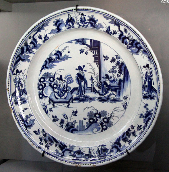 Earthenware plate with blue Chinese scene (c1700) by workshop of Edme Poterat of Rouen at Rouen Ceramic Museum. Rouen, France.