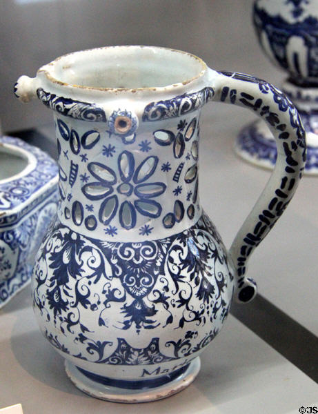 Earthenware puzzle jug with blue foliage (end 17thC) from Rouen at Rouen Ceramic Museum. Rouen, France.
