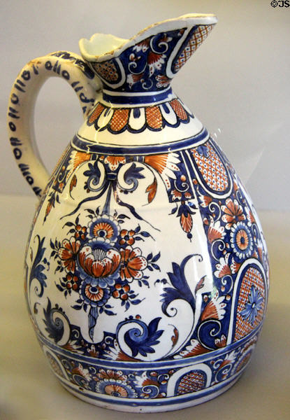 Rouen-made earthenware pitcher painted blue & red (c1730) at Rouen Ceramic Museum. Rouen, France.
