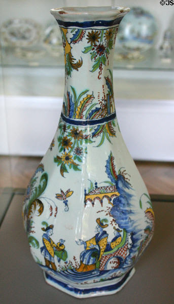 Rouen-made earthenware octagonal bottle painted with Chinese scene in multiple colors (c1730) at Rouen Ceramic Museum. Rouen, France.