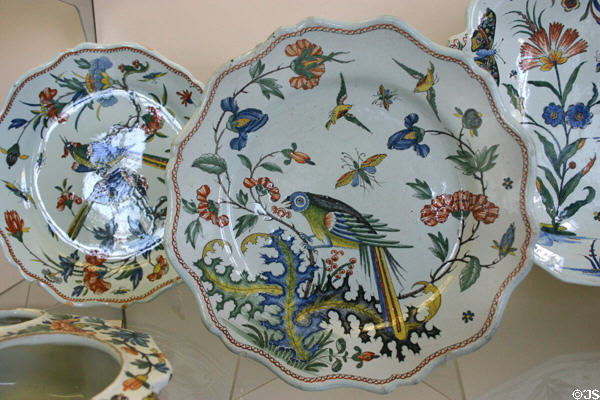 Polychrome plates with bird (c1770) from Rouen at Rouen Ceramic Museum. Rouen, France.