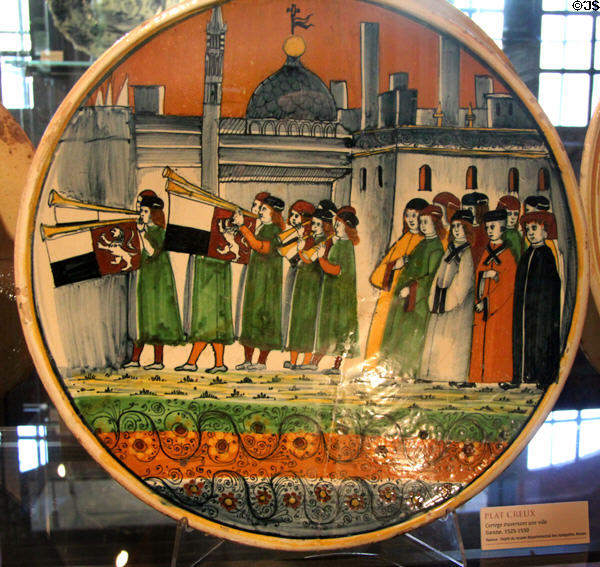 Earthenware plate with procession painting (1525-50) from Sienna, Italy at Rouen Ceramic Museum. Rouen, France.