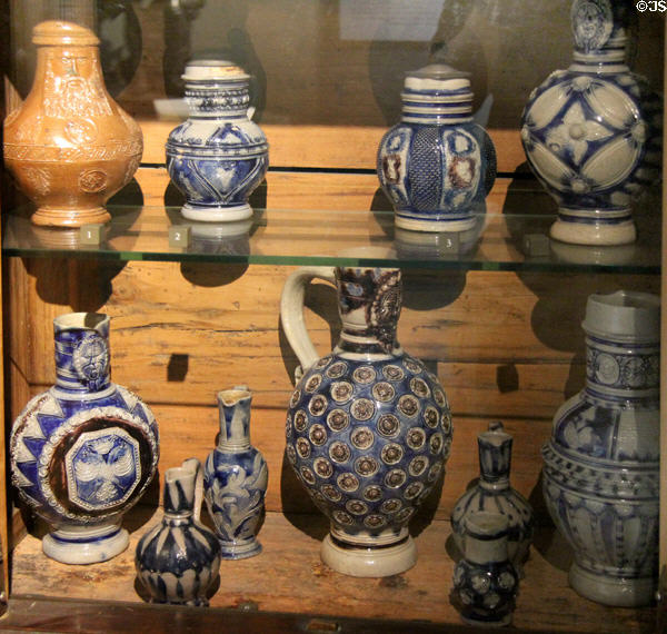 Germanic salt glaze stoneware steins & pitchers (16th-18thC) at Rouen Ceramic Museum. Rouen, France.