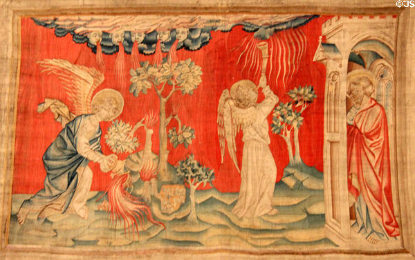 Angel empties his censer & blows trumpet from Apocalypse Tapestry at Angers Chateau. Angers, France.