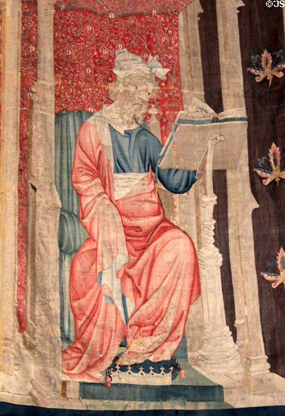 Large figure under canopy introducing new section of Apocalypse Tapestry at Angers Chateau. Angers, France.