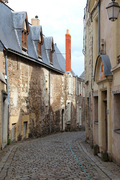 Narrow cobble stoned street in Angers old town. Angers, France.