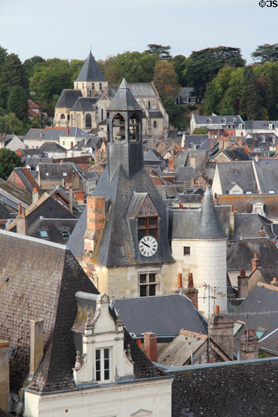 Clock tower (14C) & St. Denis church (12C) among roofs of old town. Amboise, France.