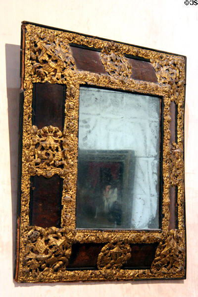 Antique mirror set in highly ornate filigree frame at Château de Clos Lucé. Amboise, France.