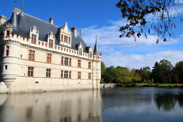 Château d'Azay-le-Rideau with aligned windows & dormer windows looking onto Indre River. Azay-le-Rideau, France.
