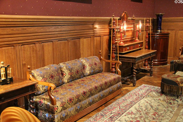 Sofa with wooden frame & ornate upholstery in Billiards Room at Château d'Azay-le-Rideau. Azay-le-Rideau, France.