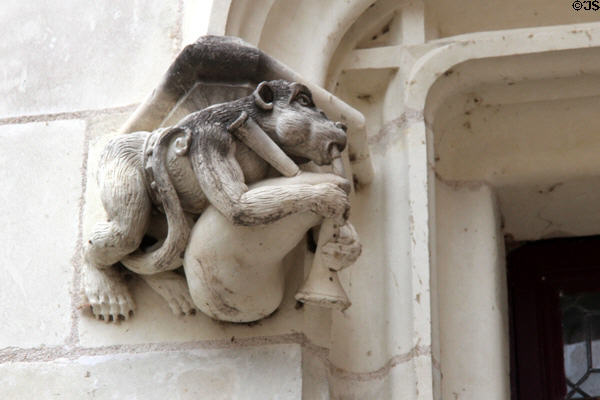 Monkey playing bagpipe corbel on window surround of Louis XII Gothic wing at Blois Chateau. Blois, France.