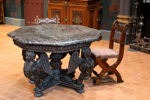 Octagonal table with sphinx base (19thC) & chairs (c1853) by Augustus Pugin at Blois Chateau. Blois, France.