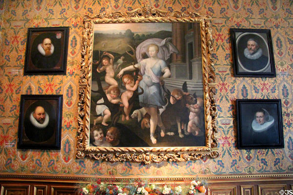 Diane de Poitiers as Diana the Huntress painting (1556) by Primaticcio surrounded by collared portraits of era at Chenonceau Chateau. Chenonceau, France.