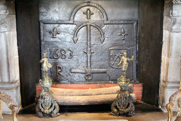 Cast iron fireplace back (1683) in Louis XIV's drawing room at Chenonceau Chateau. Chenonceau, France.