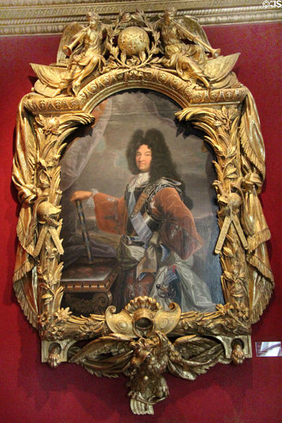 Portrait of Louis XIV by Hyacinthe Rigaud in frame by Lepautre at Chenonceau Chateau. Chenonceau, France.