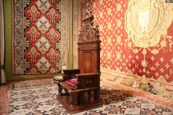 Throne room with throne (1871) of Count of Chambord & Tapestries with Arms of France (1870) at Chambord Chateau. Chambord, France.