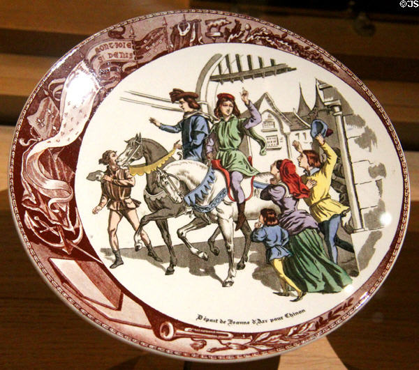 Joan of Arc departs for Chinon porcelain plate (1905) By Sarreguemines Factory in Royal Lodgings museum at Château de Chinon. Chinon, France.