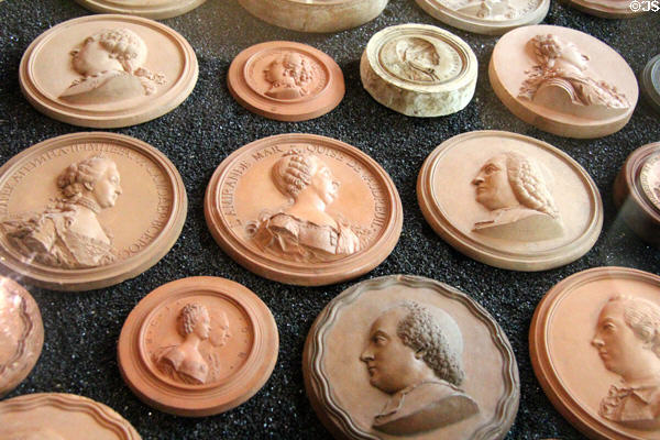 Terra cotta medallion (18thC) portraits of prominent people by Giovanni Battista Nini from Urbino at Chaumont-Sur-Loire. France.