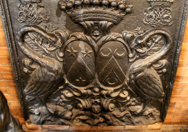 Cast iron fireback with swans (late 17thC) in Council Chamber at Chaumont-Sur-Loire. France.