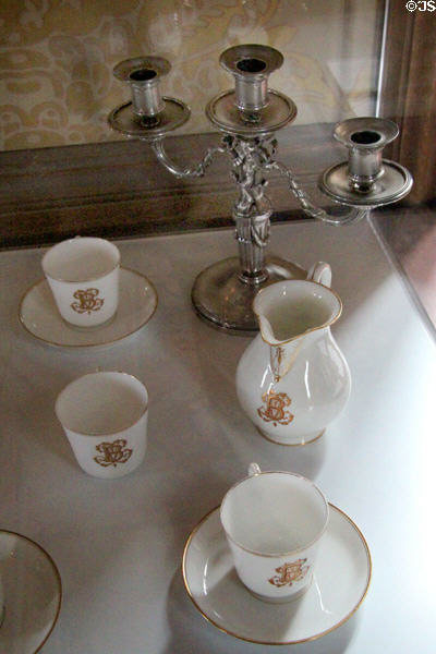 Porcelain coffee service with monogram of Broglie family (late 19th - early 20thC) by Lavoine of Paris with silver candelabra at Chaumont-Sur-Loire. France.