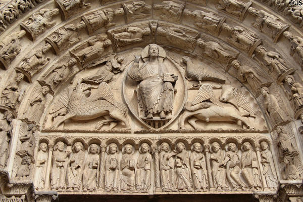 Central portal with Christ & symbols of 4 Evangelists over saints Chartres Cathedral. Chartres, France.