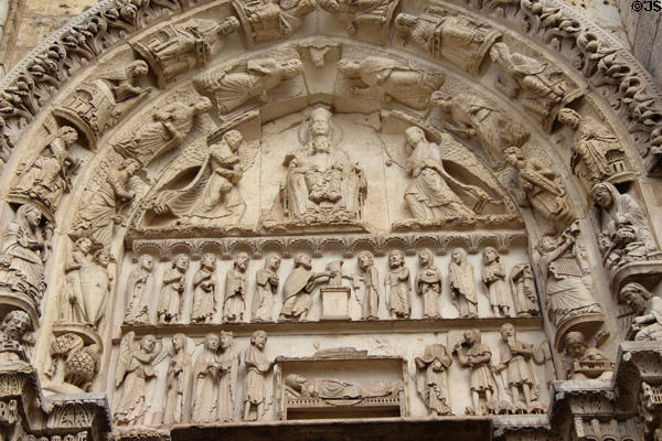 Arched doorway tympanum carved with symbols of Virgin Mary at Chartres Cathedral. Chartres, France.