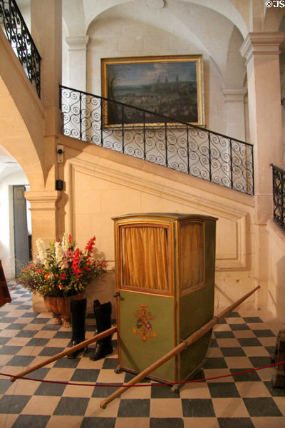 Sedan chair (18thC) in Grand staircase at Chateau D'Ussé. Ussé, France.