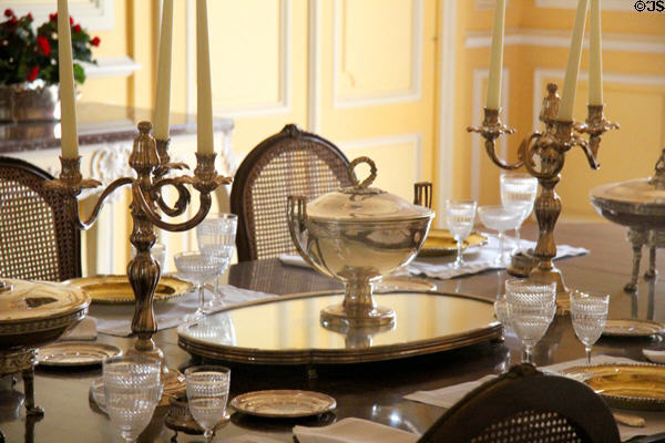 Silver serving pieces, dinner service & glasses in dining room at Chateau D'Ussé. Ussé, France.