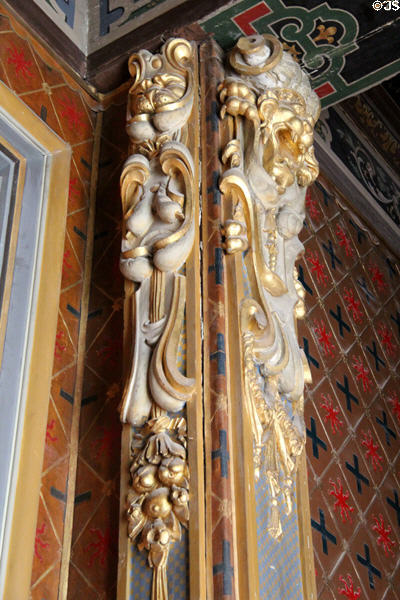 Dining room columns carved with grotesque figures at Cheverny Chateau. Cheverny, France.