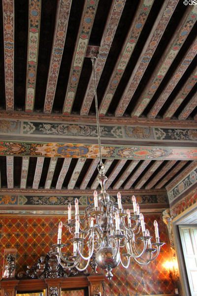 Dining room Dutch silver plated chandelier (18thC) hangs from painted beams at Cheverny Chateau. Cheverny, France.