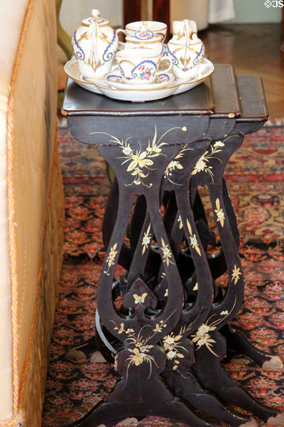 Inlaid stacking tables with coffee service in Birth chamber at Cheverny Chateau. Cheverny, France.