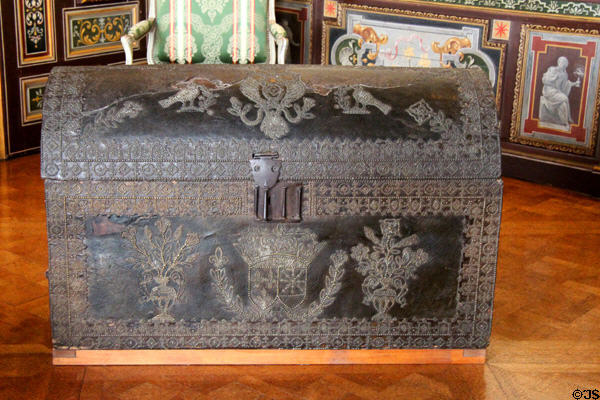 Leather covered trunk which belonged to Henri IV in arms room at Cheverny Chateau. Cheverny, France.