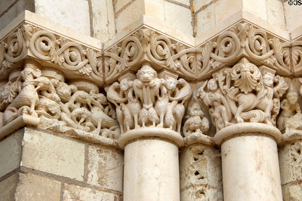 Replica with original sections of Medieval stone carvings around front entrance at Fontevraud Abbey. Fontevraud, France.