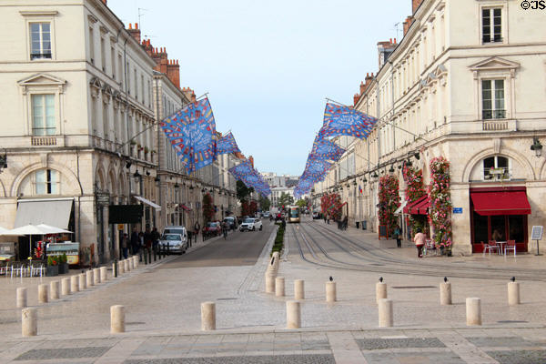 Street scene down rue Jeanne d'Arc from Place Ste. Croix. France.