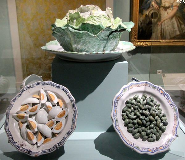 Collection of trompe l'oeil faience plates (18thC) from France at Orleans Beaux Arts Museum. Orleans, France.