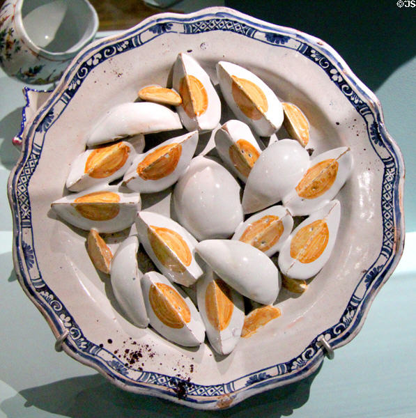 Trompe l'oeil faience plate with fake hard boiled eggs (18thC) from France at Orleans Beaux Arts Museum. Orleans, France.