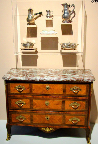Collection of French silver (18thC) over French commode (c1770) at Orleans Beaux Arts Museum. Orleans, France.