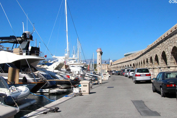 Profusion of yachts moored along walls of Old Port. Antibes, France.