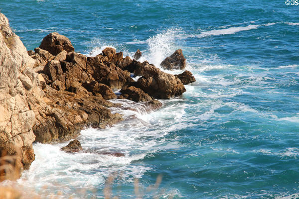 Mediterranean breaks on rocky shoreline. Antibes, France.