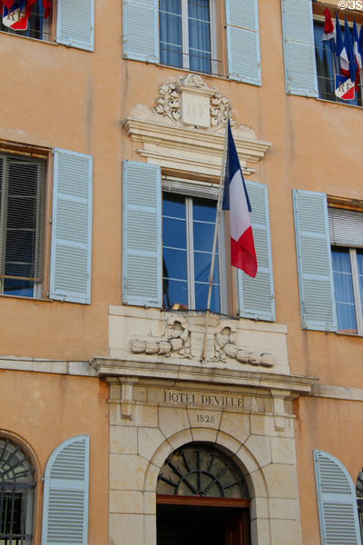 Front entrance of City Hall (Hotel de Ville) with French flag. Antibes, France.