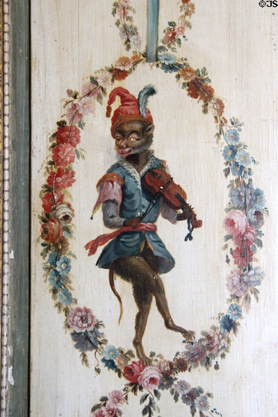 Wall panel with costumed monkey playing violin framed in garland of flowers in Monkey salon at Villa Ephrussi de Rothschild. Saint Jean Cap Ferrat, France.