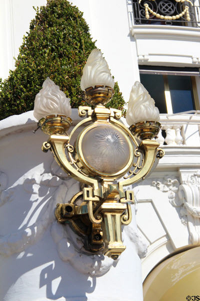 Ornate brass & frosted glass lamp on Hotel Le Negresco on Promenade des Anglais. Nice, France.
