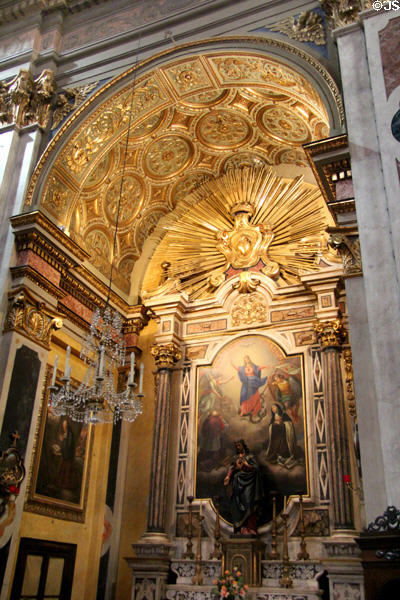 Gilded arch, sun burst & other baroque elements above altar of Eglise Notre Dame de l'Annonciation in Old Nice. Nice, France.