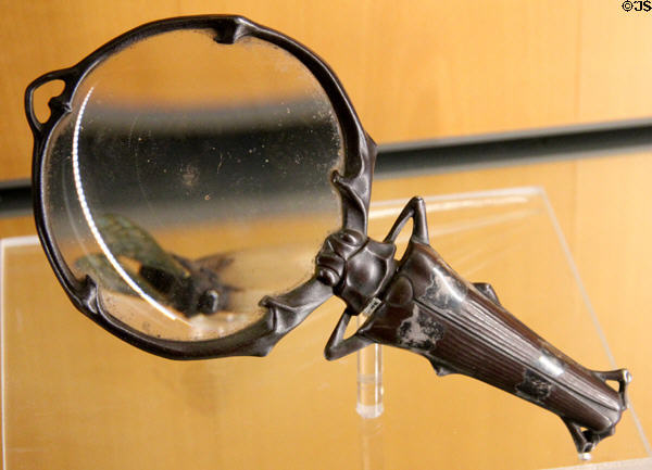 Art nouveau bronze magnifying glass held by insect figure (1907) by Lucien Gaillard at Beaux-Arts Museum. Lyon, France.