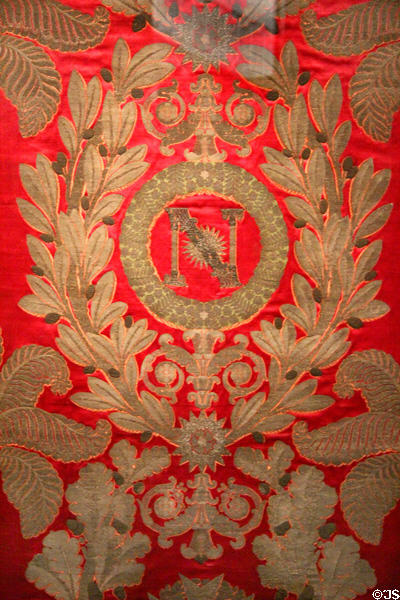 N in wreath for Versailles throne room of Napoléon Bonaparte woven silk hanging (1806-8) by Camille Pernon at Musées des Tissus. Lyon, France.
