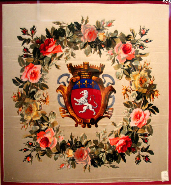 Silk cloth with crown of roses around arms of Lyon (1889) by Maison Ogler, Duplan et Cie shown at l'Exposition universelle de Paris of 1889 at Musées des Tissus. Lyon, France.