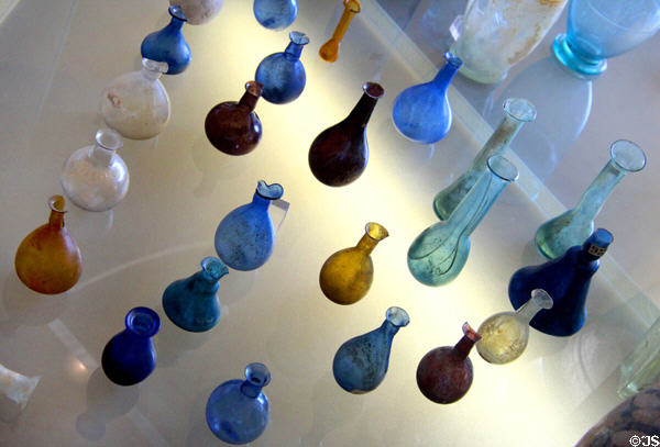 Collection of Roman glass bottles (1st-4thC) at Gallo Roman Museum. Lyon, France.