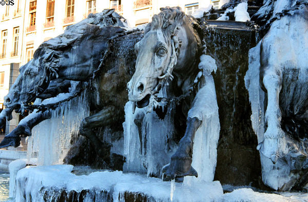 Bartholdi fountain detail with icicles. Lyon, France.