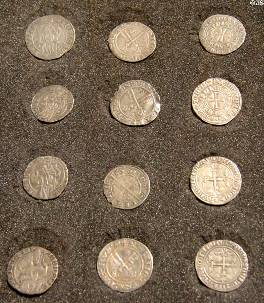 Papal coins (14thC) with faces & symbols of Avignon popes at Papal Palace. Avignon, France.